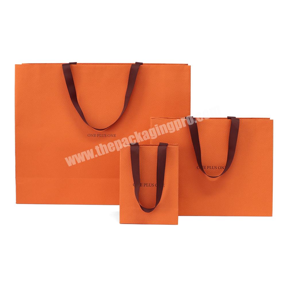 Custom Branded Logo Luxury Texture Paper Clothing Packaging Gift Shopping Bag Paper bag With Ribbon Handle