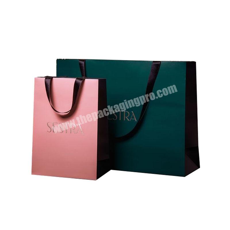 https://thepackagingpro.com/media/images/product/2023/5/Eco-Friendly-Custom-Wholesale-Clothing-Green-Paper-Bags-with-Your-Own-Logo-Print-Garnent-Gift-Paper-Bag-For-shoes-Jewelry-Wigs_Ha50Vby.jpg