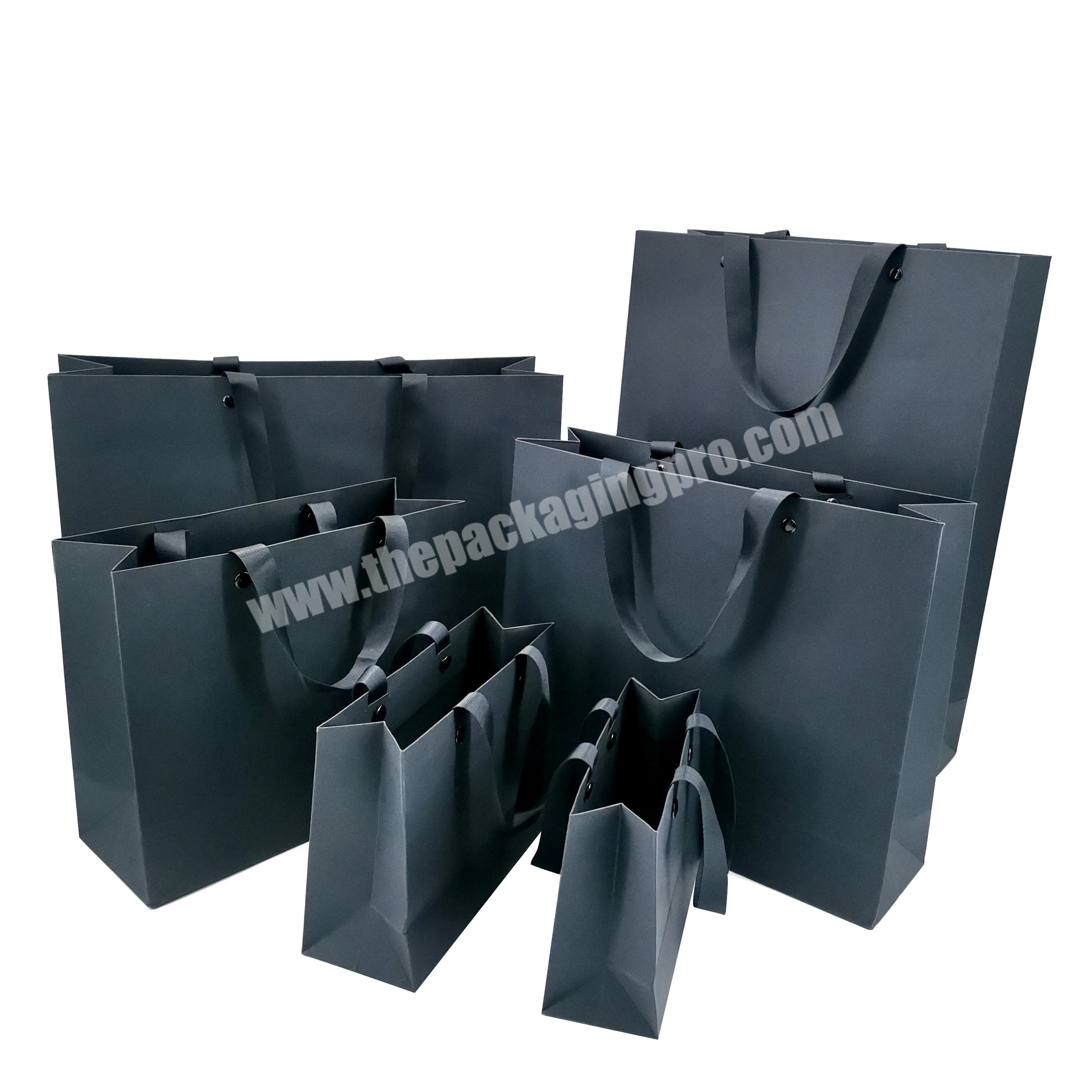 Hot sale black and white paper shopping gift clothing package bag with ribbon handle