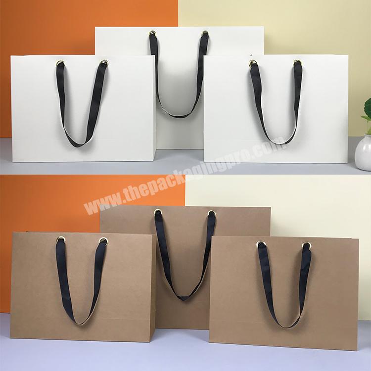 Lipack Metal Eyelet Black Cardboard Paper Bag Luxury Fancy Shopping Bag With Shoulder Length Ribbon Handle