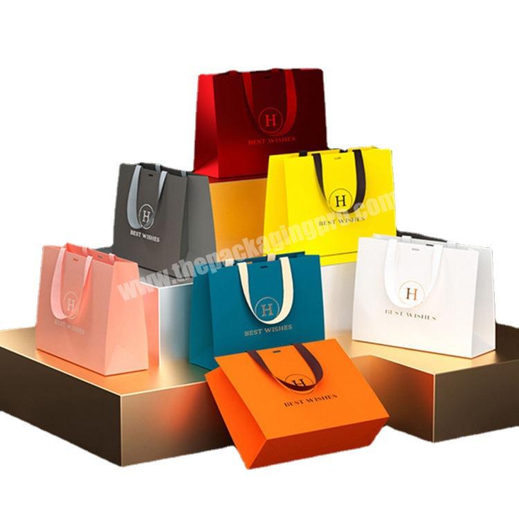 Wholesale Logo Printed Luxury Kraft Retail Paper Tote Bag Shopping Bag Paper Gift Bag With Handle and Ribbon Close
