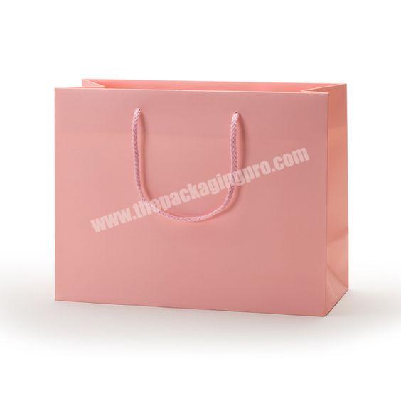 Wholesale cheap wide base kraft white cardboard paper bag print your own logo small or large bags with twisted rope handle