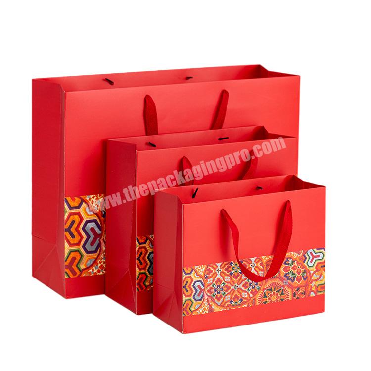 Wholesale custom printed luxury shopping gift paper bag with handle