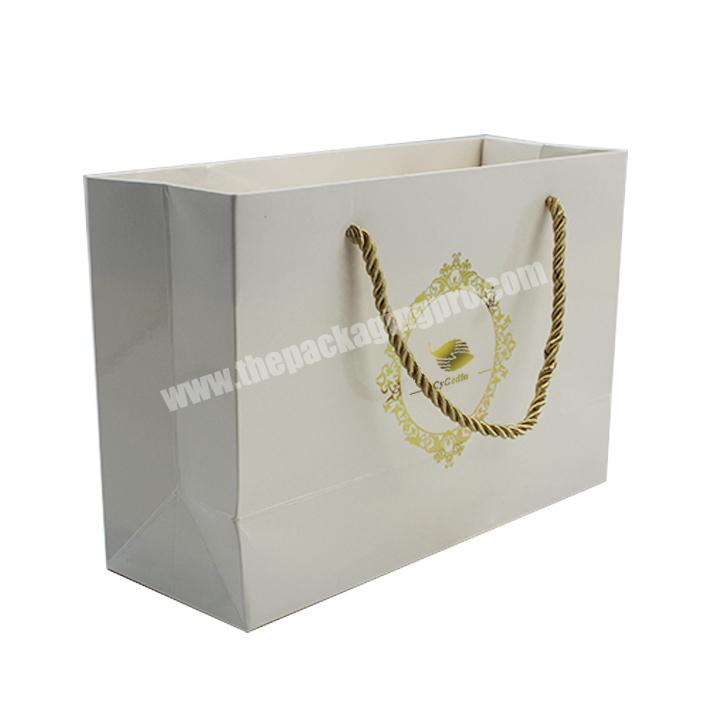 Wholesale luxury white clothing packaging paper bag printing custom logo bronzing clothing shopping gift jewelry packaging paper