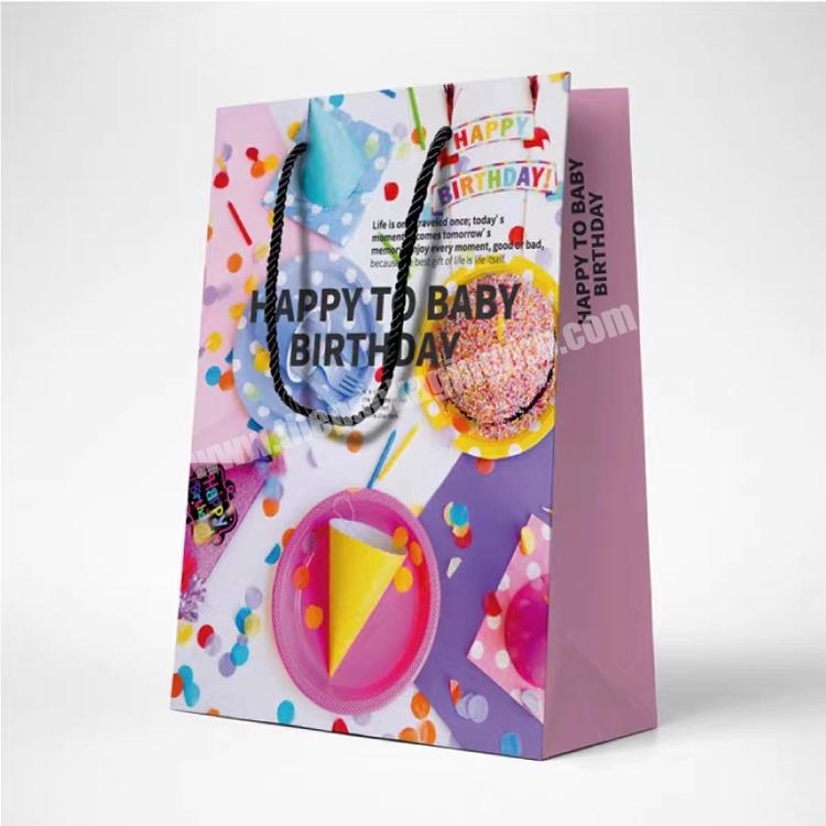 2023 hot selling supply wholesale price cartoon printed golden supplier gift paper bags with ribbon handle