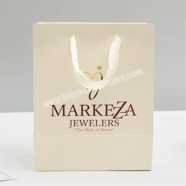 Custom Logo Printed Matt Fashion Packaging Kraft Paper Bag Shopping Gift Wrapping  Paper Bag for Cosmetics/Clothing/Gifts - China Bags, Bag