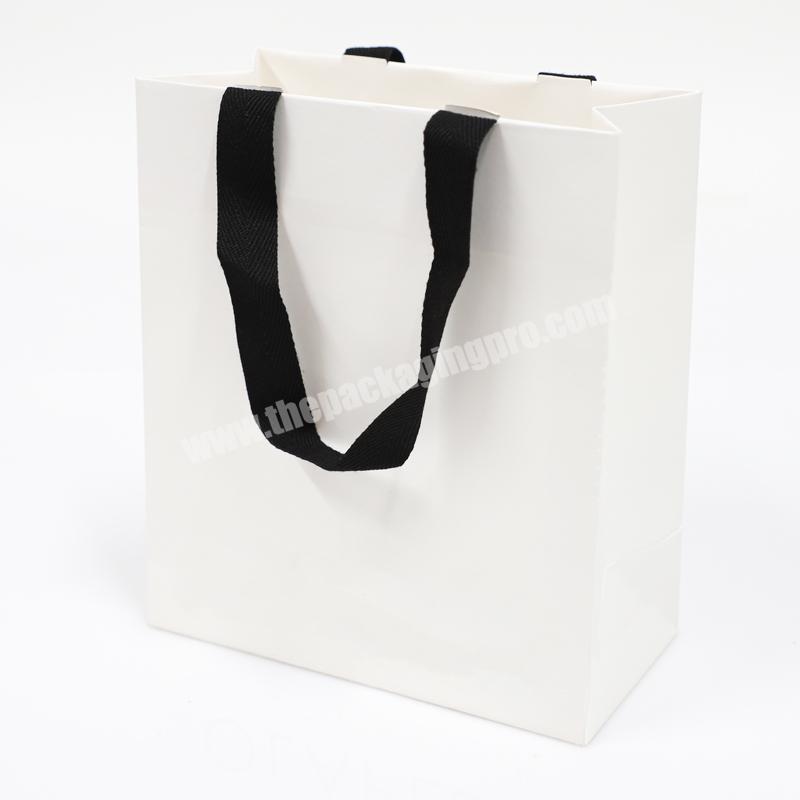 Factory direct supply customized logo reusable tote luxury paper bag clothing shopping bag custom gift bags with handle