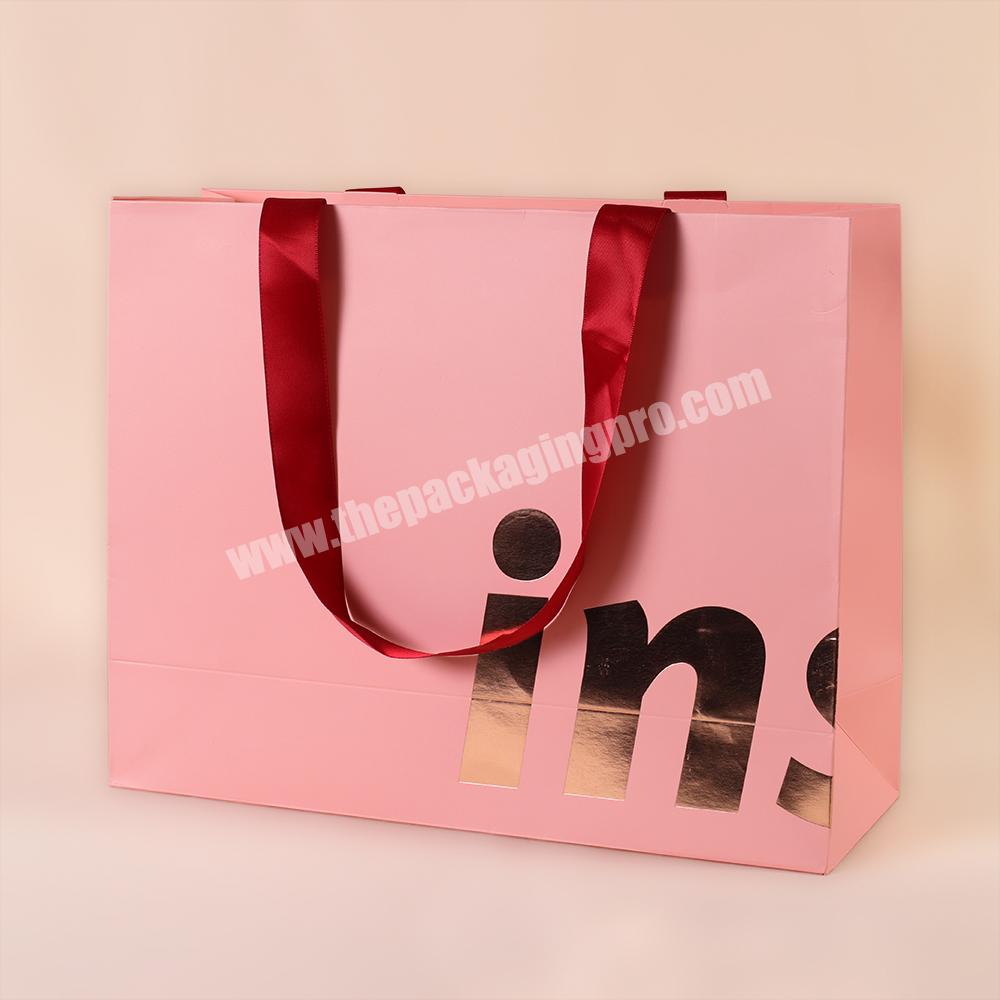 High Quality Luxury Wrapping Paper Storage Bag Customized Logo Manufacturer Pink Shopping Bag For Clothing With Ribbon Handle
