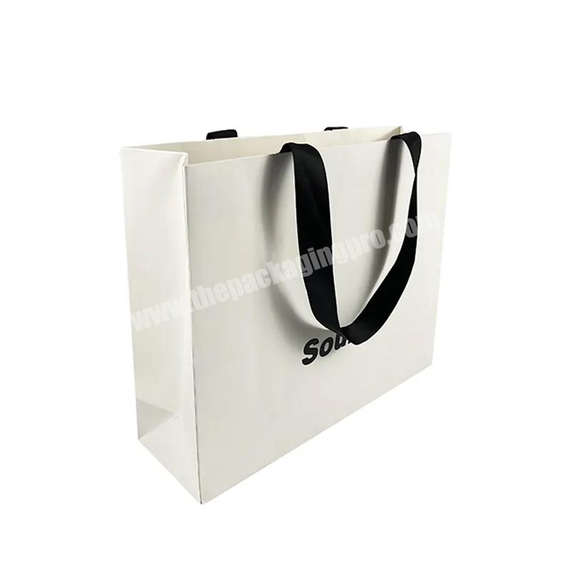 Luxury Custom Shopping Paper Bag with Logo premium golden Paper Packaging custom gift bags