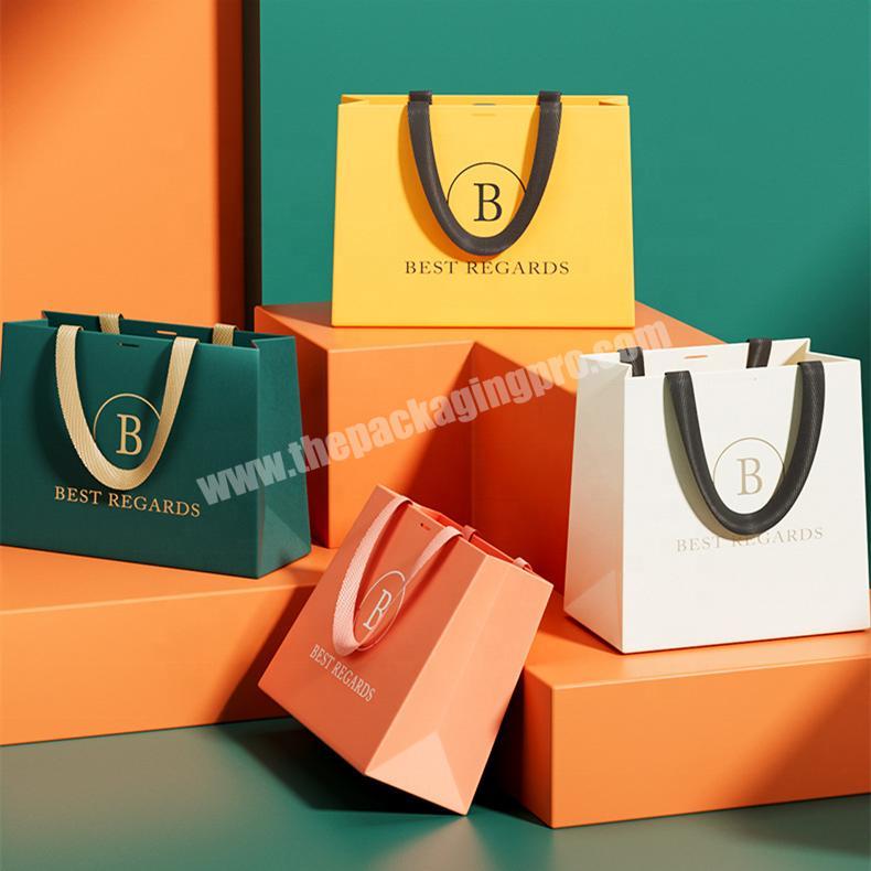 Yiwu Ming Huang Custom Matt Laminated Large White Paper Bag Luxury Shopping Bag Small Jewelry Gift Bags With Logo