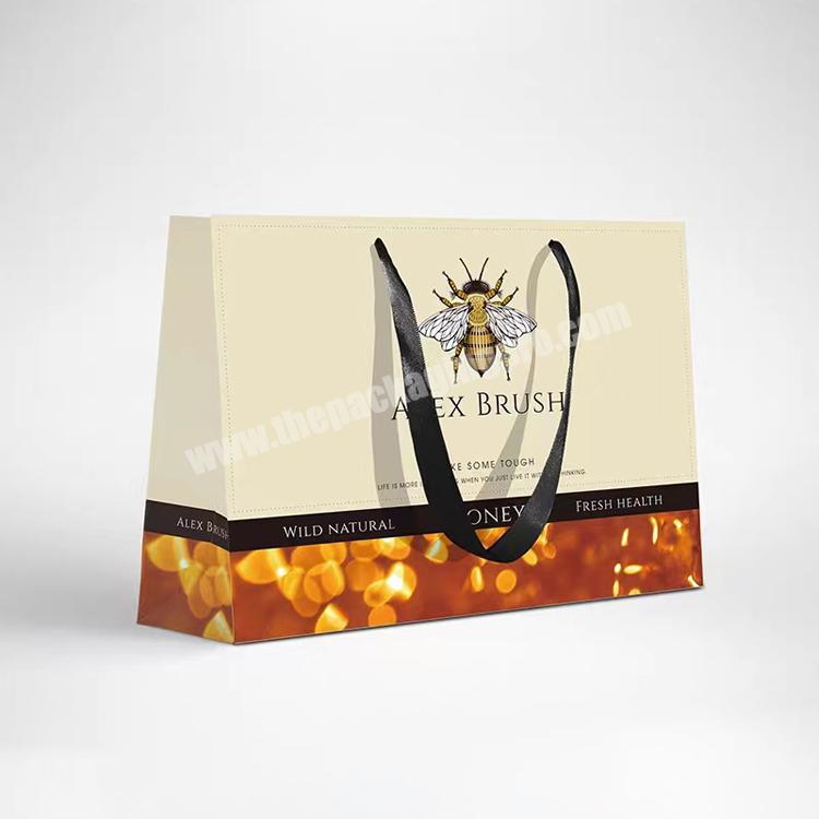 wholesale price small black kraft embossed uv hot stamping packaging envelope paper gift bag manufacturer